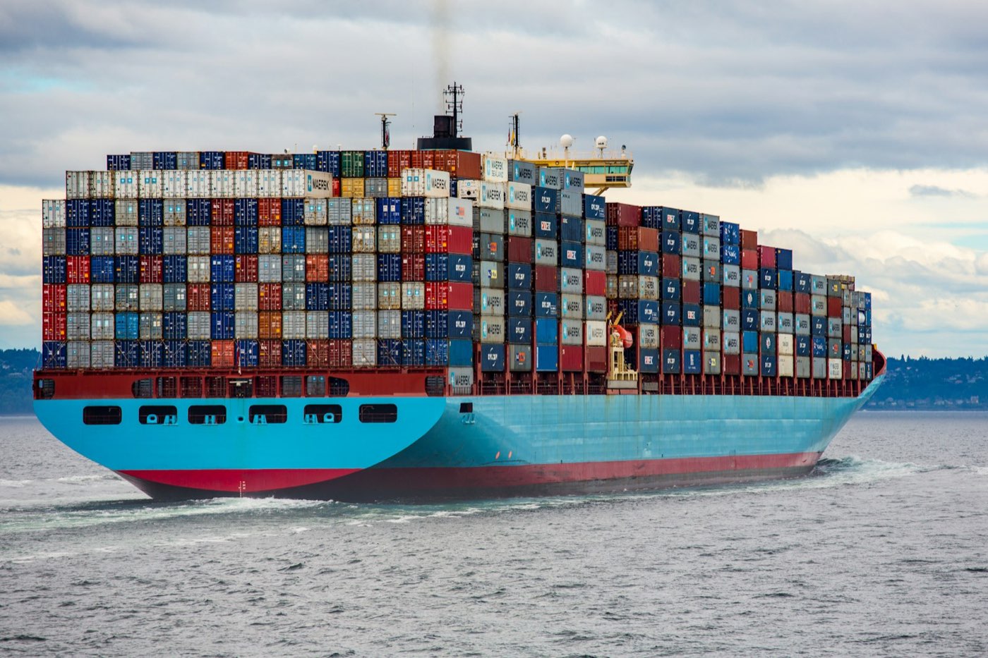 A fully loaded container ship underway at sea